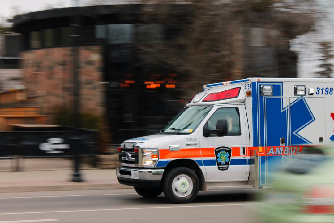 Ambulance driving through city